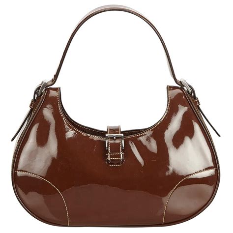 tan leather hobo bag with bow prada